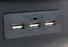 Подлокотник из экокожи с прострочкой с крышкой на кнопке, подстаканником и USB универсальный